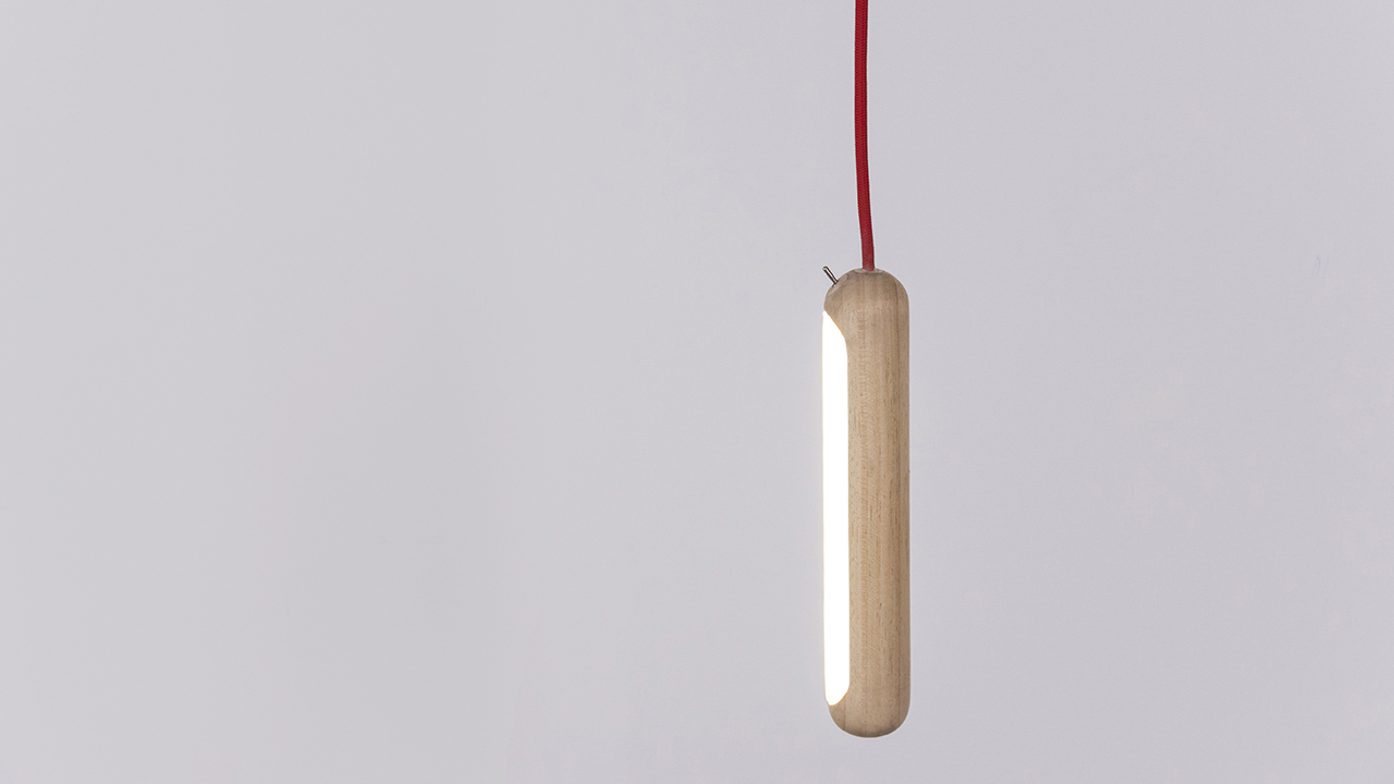 pod light hanging from his red fabric cable